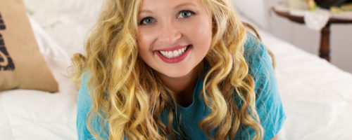 Blond curls blue t-shirt boudoir photo session