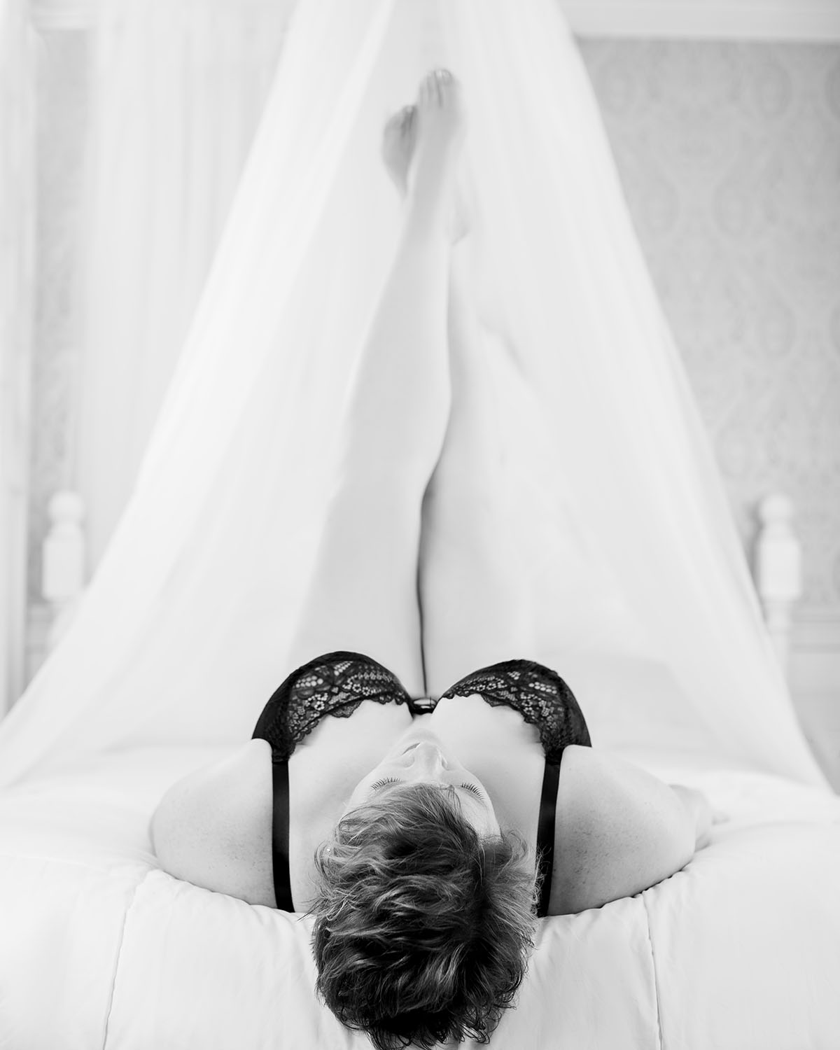 black and white legs up boudoir in black bra I smiled all night